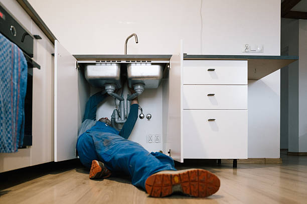Professional Emergency Plumber technician working in Arlington, IN